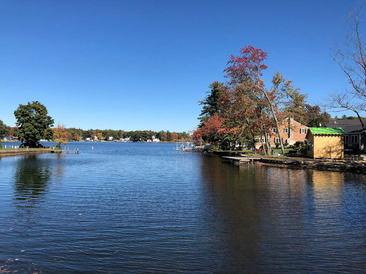 Arlington Mill Reservoir with a kayak on the water in early fall in Salem NH
