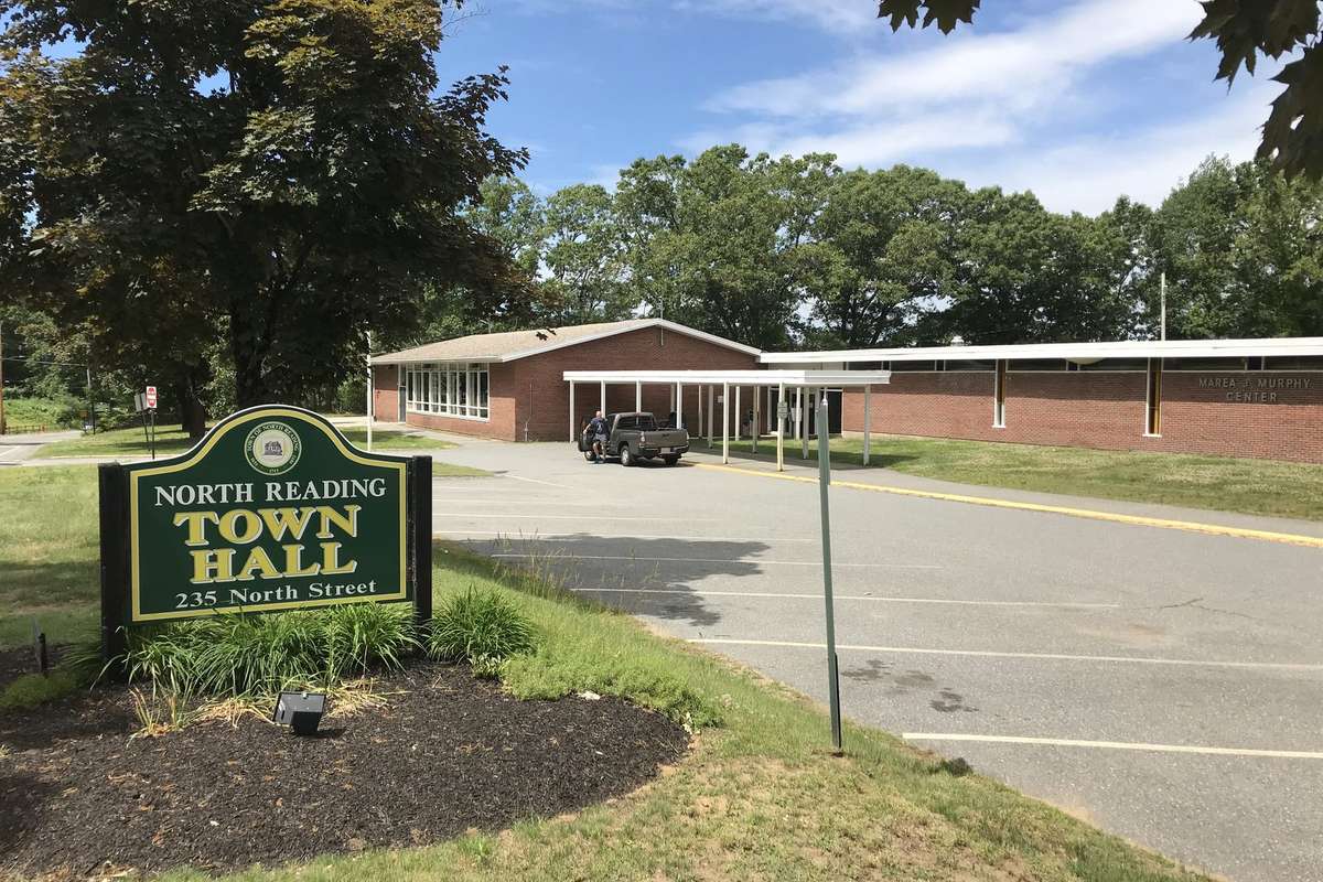 The green town hall sign at 235 North Street on a summer day in North Reading MA