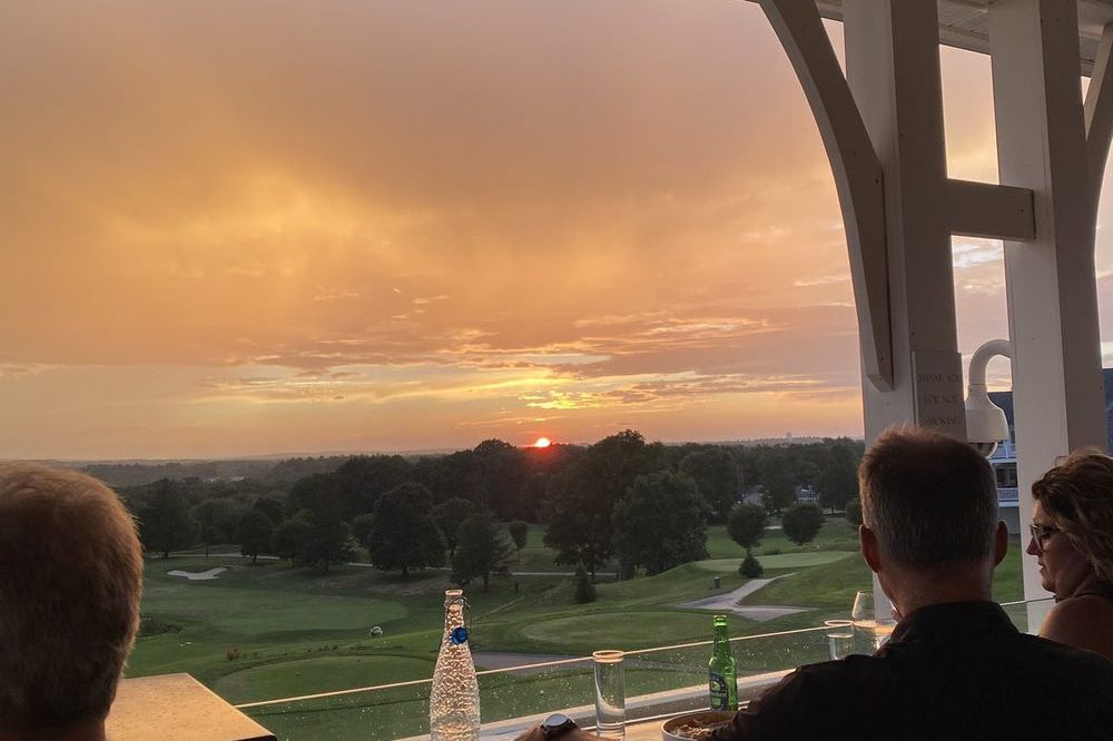 Sunset over a golf course in Methuen MA