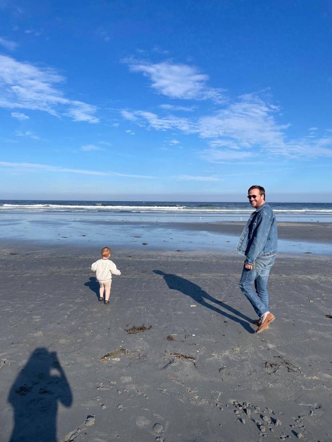 Steve walking on the beach with his son
