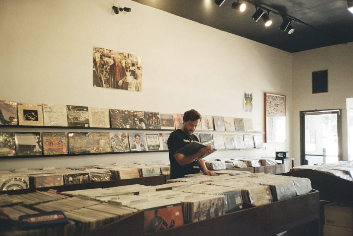 Steve Wallace flipping through used records at Gimme Gimme Records in Los Angeles CA